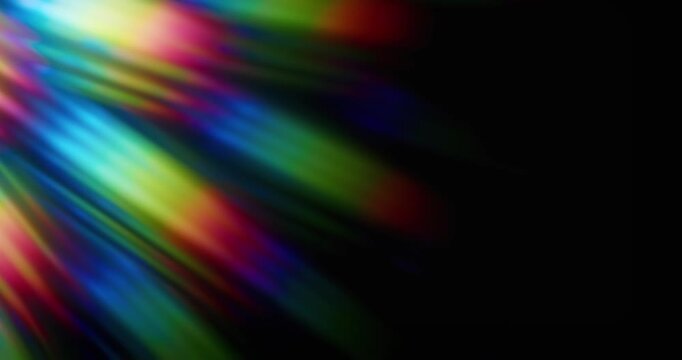 Light shining into a prism creating lens flare in a vivid rainbow of random dancing light rays. Optical effect of a light refraction creating chromatic aberration in a spectrum colors. Loop