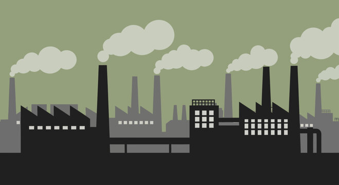 Industrial factory buildings with smoking chimneys polluting the environment.