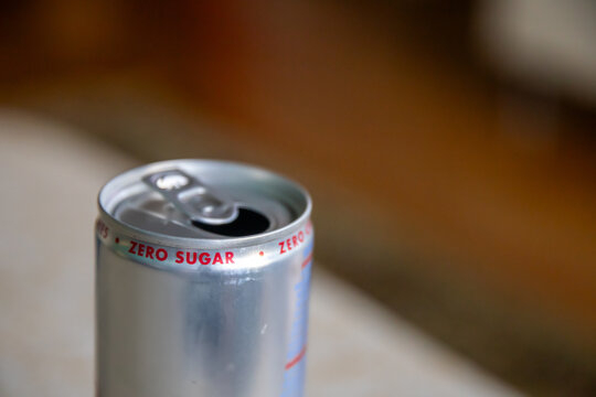 Open Silver Zero Sugar Energy Drink Can Close-Up on Table