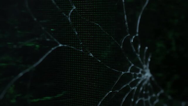 Cracked screen with green display.