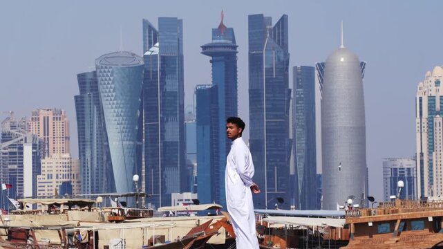 Lifestyle scene with man and futuristic skyline in Doha