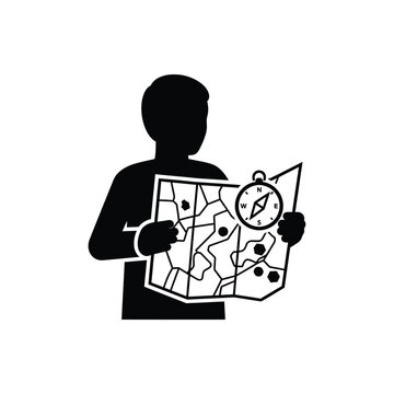 Person holding map and compass for navigation and exploration.