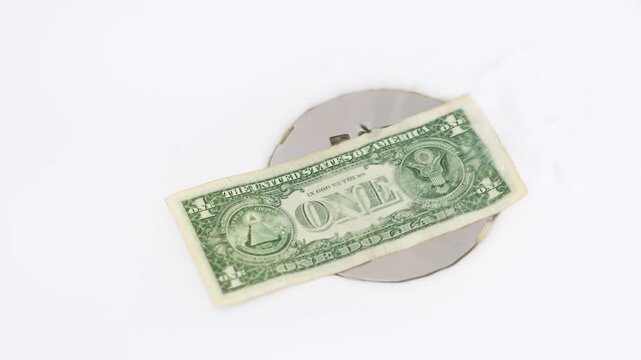Dollar Bill Over Drain with Running Water
