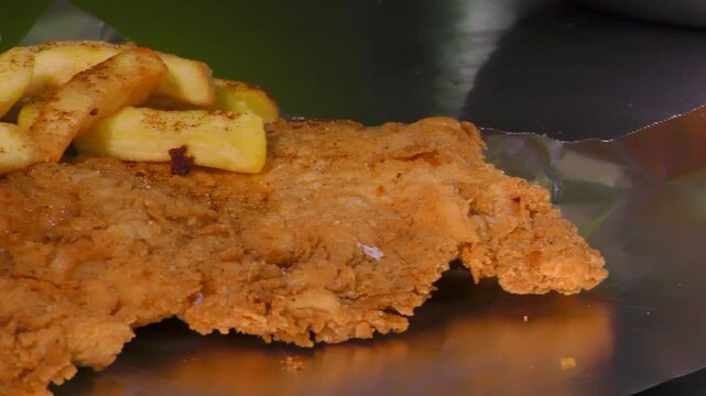 Papas a la francesa con chuleta