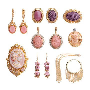 Array of ornate vintage jewelry, gold tone, various shapes, intricate designs, isolated