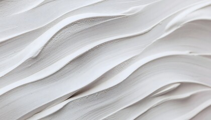 Fototapeta premium White textured plaster surface with wavy ridged patterns and soft shadows for background.
