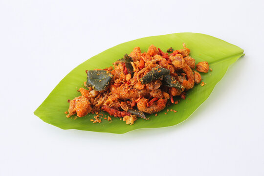 Nam Prik Kak Moo, or Nam Prik Nung Kai Krob (crispy chicken skin chili paste), is a popular Thai dish featuring crispy fried pork cracklings or chicken skin mixed with herbs and chili powder.