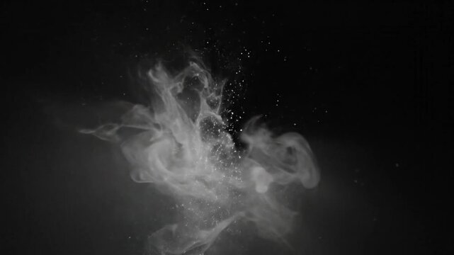 Black and white explosion with particles and billowing smoke on dark background, artistic movement