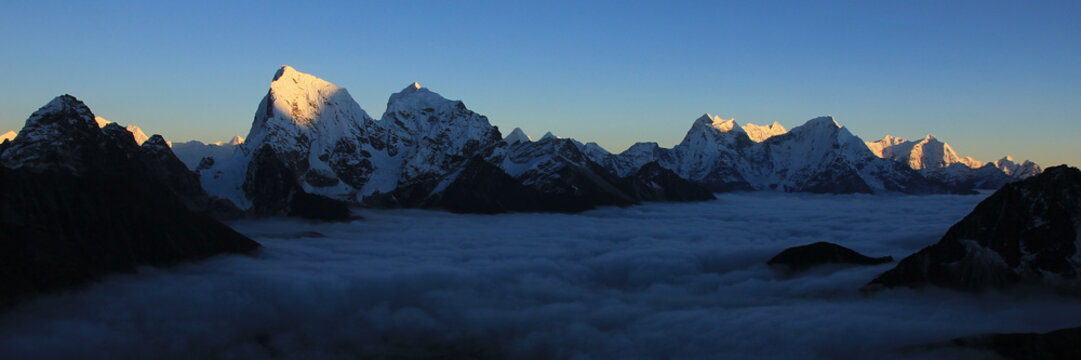 High mountains Cholatse, Kantega, Thamserku and Kusum Kanguru at sunset seen from Gokyo Ri, Nepal.
