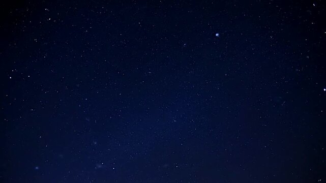 Dark blue night sky with scattered stars a serene and peaceful celestial backdrop.