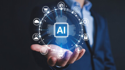 Fototapeta premium Businessman hand holding artificial intelligence processor with data network and business icons surrounding.