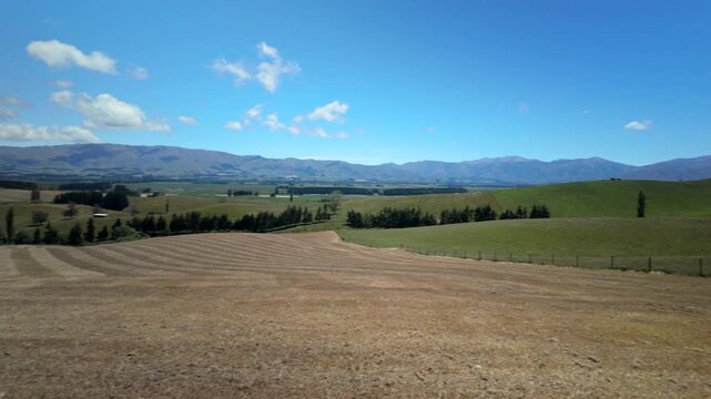 Rolling Green Hills Under Blue Sky