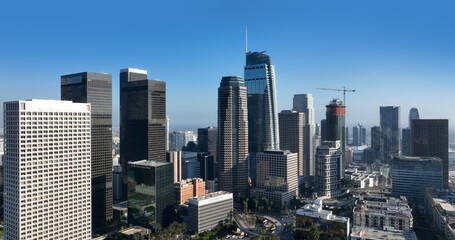 Obraz premium Los Angeles skyline blue sky urban panorama. Los Angeles downtown skyline financial center. Los Angeles modern architecture skyscraper skyline. Los Angeles aerial cityscape sunny day.