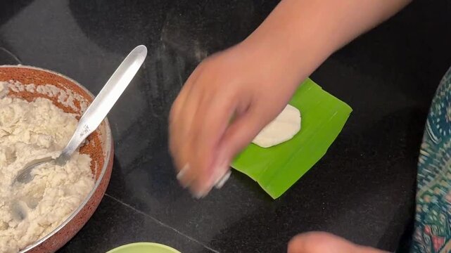 Making ela ada dish exotic kerala dish