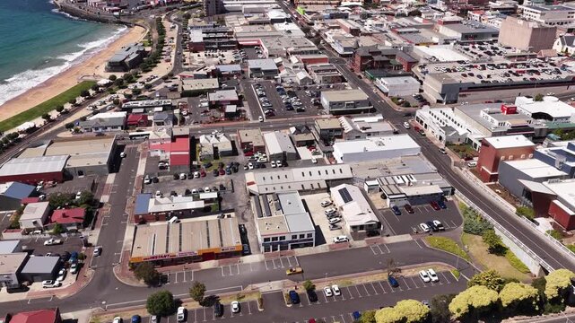 Lift over city streets to port infrastructure on the coast in Burnie city of Tasmania &ndash; aerial cityscape.