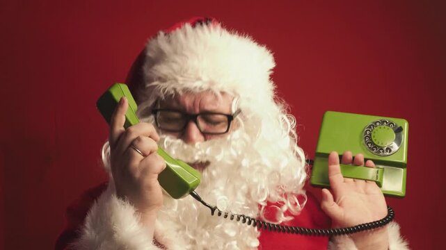Man in santa costume suffering from severe headache or stress during Christmas. Face of stressed male Santa Claus character with migraine.