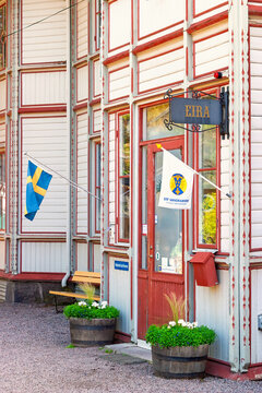 Swedish hostel entrance with flags and traditional wooden architecture