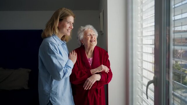 Mand adult daughter hugging, celebrating Mother's Day.