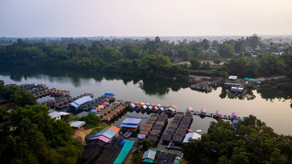 A tourist destination, a holiday retreat, a river, trees, a perfectly balanced and beautiful landscape, eco-friendly relaxation, photographed from a drone. © Mohwet