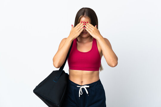 Young sport Uruguayan woman with sport bag isolated on white background with tired and sick expression