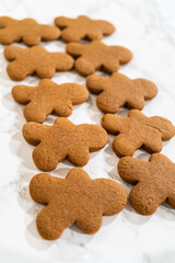 Fototapeta premium Decorating Gingerbread Man Cookies with Royal Icing for Festive Occasions