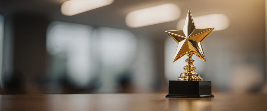 Golden star trophy award ceremony, blurred office background
