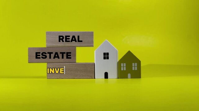 The words &ldquo;Real Estate Investment&rdquo; engraved on it, symbolizing property growth, financial planning, and long-term wealth building. The concept highlights stability, housing development, and investment