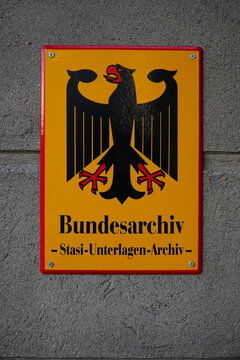 Federal Archives, Stasi (East German State Security) Archives. Metal sign at the entrance featuring the German federal eagle symbol. Berlin, Germany