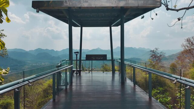 Observation deck with panoramic mountain view in Kanchanaburi province, Scenic viewpoint platform overlooking valley and hills in tropical landscape, Thailand 4k