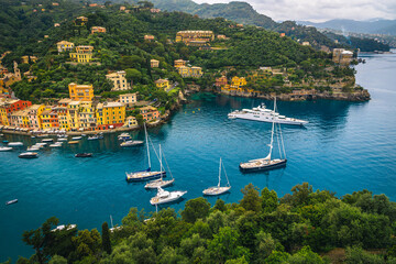 Moored boats and yachts in the bay of Portofino, Italy