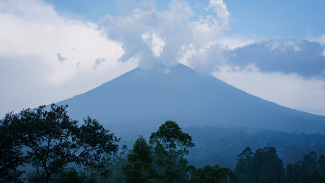 Java. Volcano surounded by dense tropical forest 