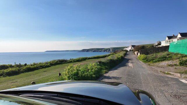 Bigbury Devon England UK. 27.03.2026. Video.  Driving along the coastal road aat Bigbury on sea in south Devon with scenic coastal views of the sea and cliffs.