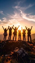 Fototapeta premium Group of People Celebrating on a Mountain Top at Sunset, Overcoming Challenges Together
