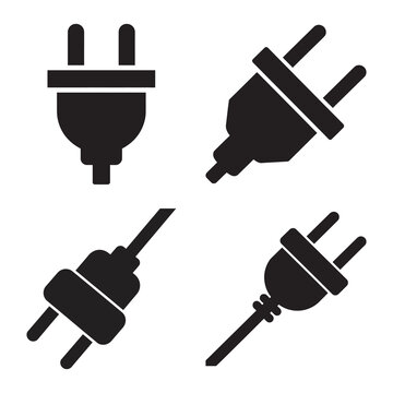 Variety of electrical plugs with cords on white background.