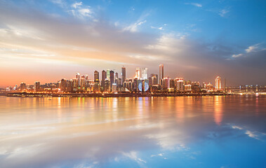 Fototapeta premium City skyline, waterfront, modern buildings, sunset, urban landscape
