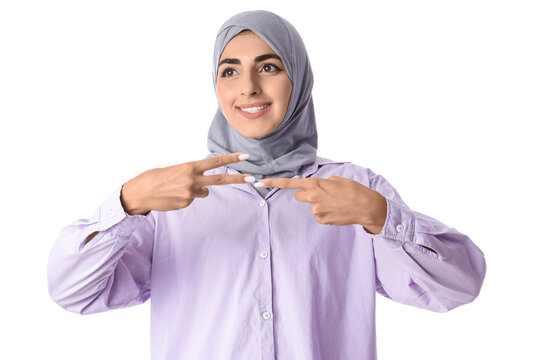 Beautiful Muslim deaf mute woman using sign language on white background
