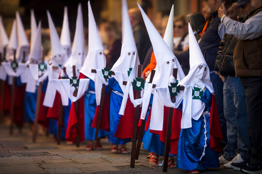 Children in traditional robes participating in a Holy Week procession. Aviles, Asturias, Spain.