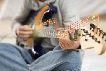 Fototapeta premium Cute boy playing electric guitar, closeup