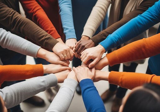 Diverse hands joined in unity teamwork diversity