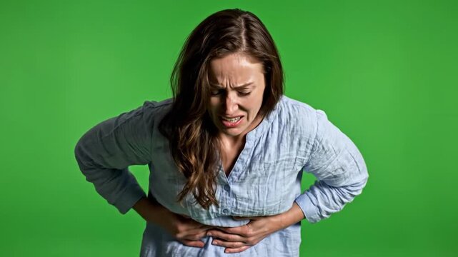Distressed Woman Suffering Abdominal Pain on Green Screen