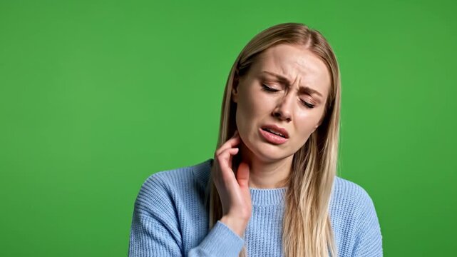 Woman Suffering from Ear Pain on Green Screen Background