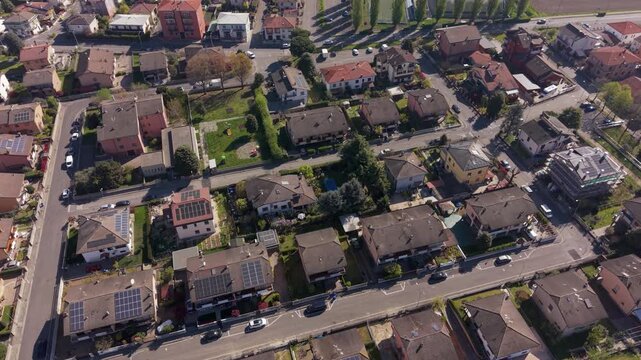 Aerial View of Urban Dwellings: A captivating aerial perspective showcases a vibrant residential area, featuring an array of homes and streets.