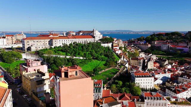 Lisbon Skyline with Sao Vicente de Fora Monastery and Graca District. Aerial Establishing Shot