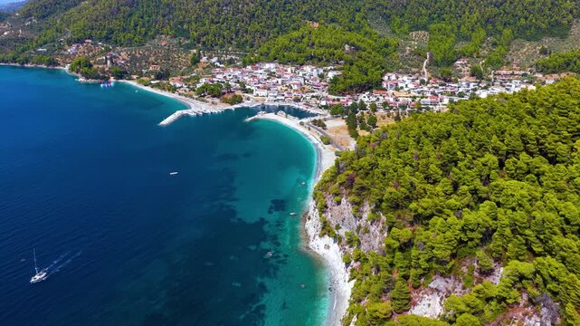 Establishing, aerial view of the beautiful coast of Skopelos island, Sporades, Greece, with the popular Hovolo beach and Neo Klima village