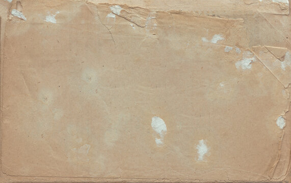 Vintage background of old ancient torn paper texture