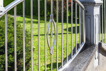 Fototapeta premium fence chrome stainless steel on wall. chromium fence 