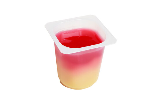 A transparent cup with vanilla and raspberry pudding, isolated on a white background.
