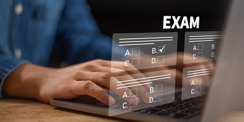 Fototapeta premium Student completing online exam on laptop using digital interface, focusing on knowledge assessment, and structured evaluation process to enhance learning efficiency in modern education systems.