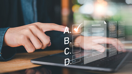 Student selecting correct answer in digital exam interface, focusing on knowledge assessment, test performance, structured evaluation process to improve learning efficiency in modern education systems © Nichaphat