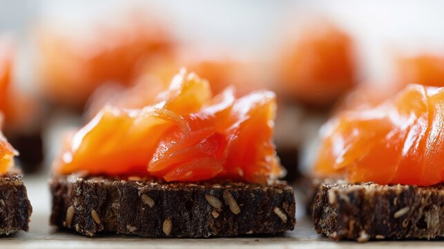 tonalite. Close-up of oily smoked salmon slices on dark rye bread. menu design, packaging mockups, designed for culinary blogs and recipe cards for restaurants, used by interior designers.